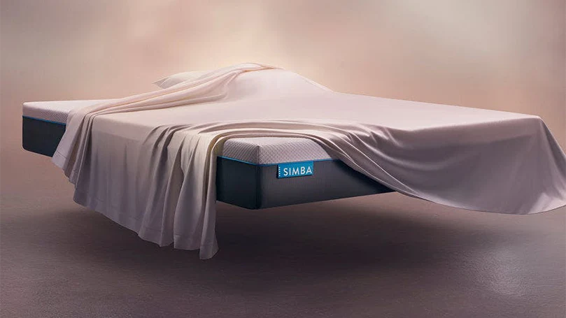 an image of simba hybrid mattress covered with a blanket