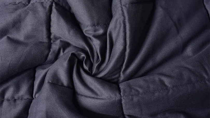 A close up image of Pro Maison Weighted Blanket's cover
