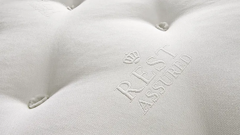A close up image of Rest Assured 2000 pocket mattress micro quilted cover.