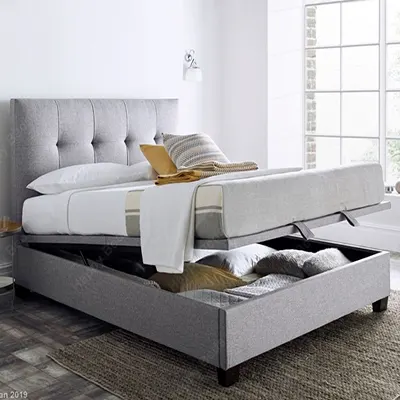 A product image of Walkworth Light Grey Fabric Ottoman Storage Bed.