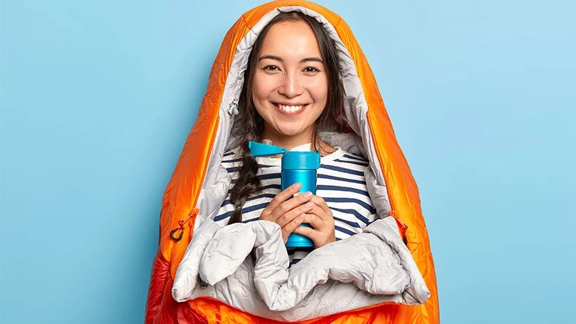 An image of a woman in a sleeping bag.