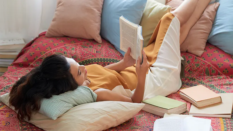 An image of a woman resting with elevated legs.