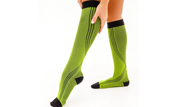 An image of a woman wearing compression socks.