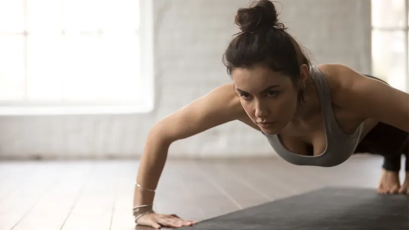 An image of a woman doing a pushup