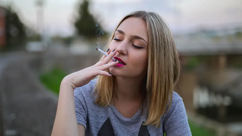 a-young-woman-smoking-a-cigarette