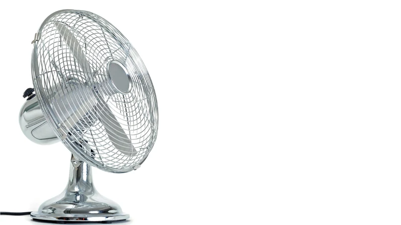 a grey metal electric fan on a white background