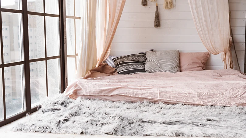 An image of scandinavian style bedroom with a canopy bed.