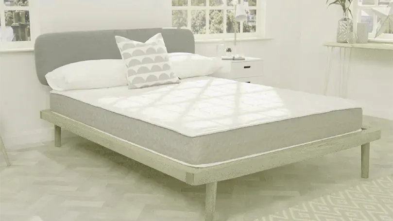 An image of Dormeo Memory Revitalise mattress in a bedroom.
