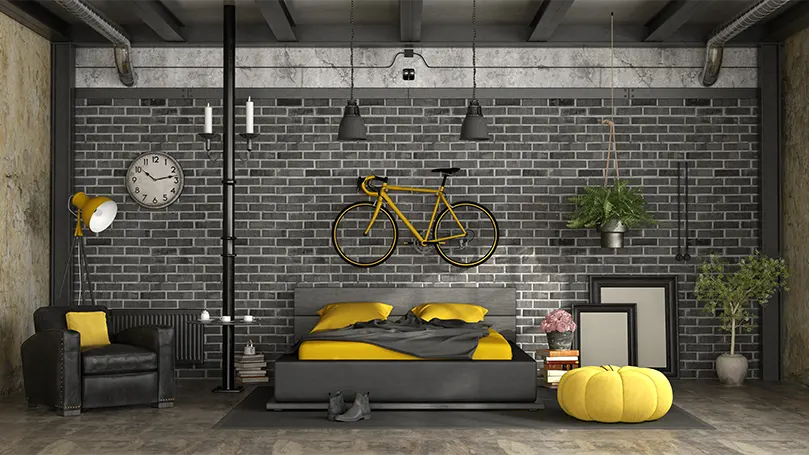 An image of a bedroom with brick wall.