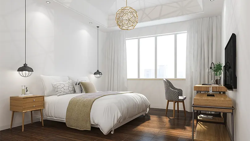 An image of a bedroom with white walls.