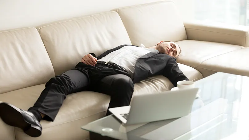 An image of a man fallen asleep due to narcolepsy.