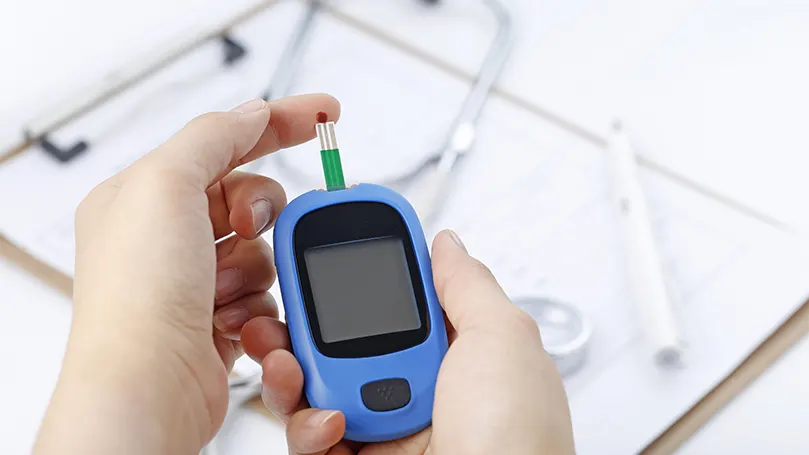 An image of a person checking their blood sugar level