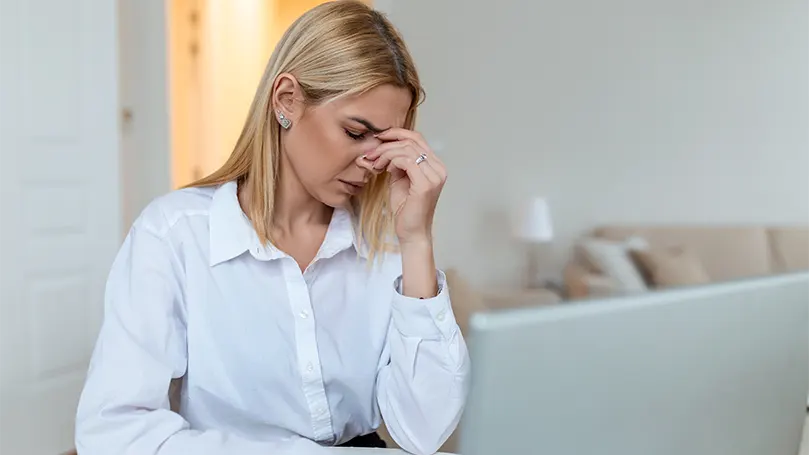 An image of a young woman suffering from vertigo.