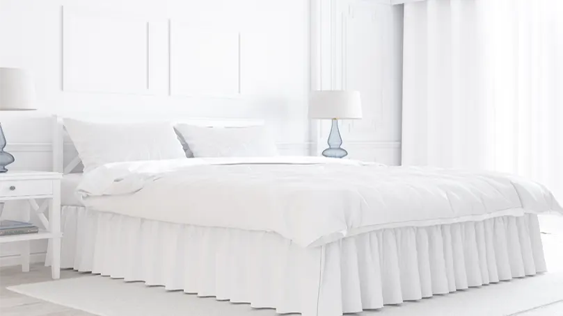An image of all white bedroom.