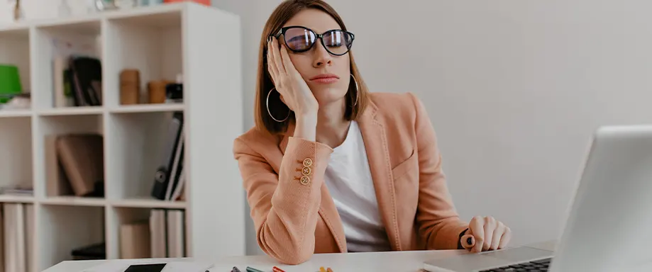 Woman napping at desk job