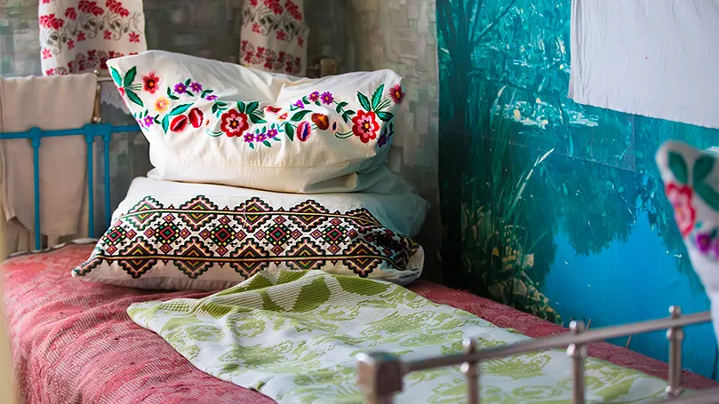An image of old pillows on an old bed.