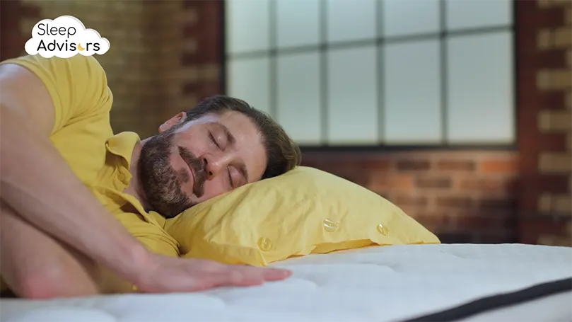 our reviewer sleeping on a SleepSoul Space 2000 mattress