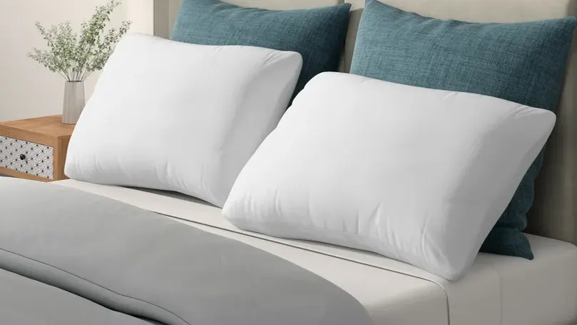 An image of Slumberdown Climate Control pillows on bed.