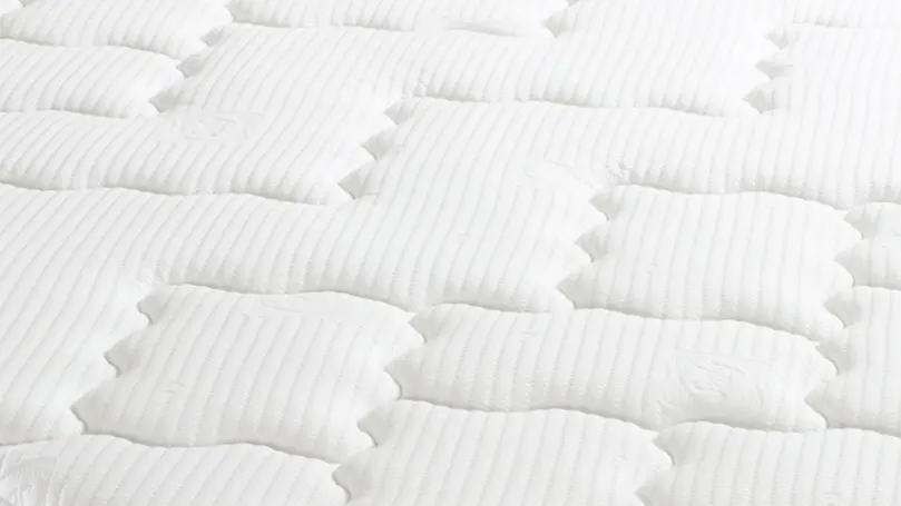 A close up image of Sealy Posturepedic Pearl Luxury Pillow Top mattress cover.