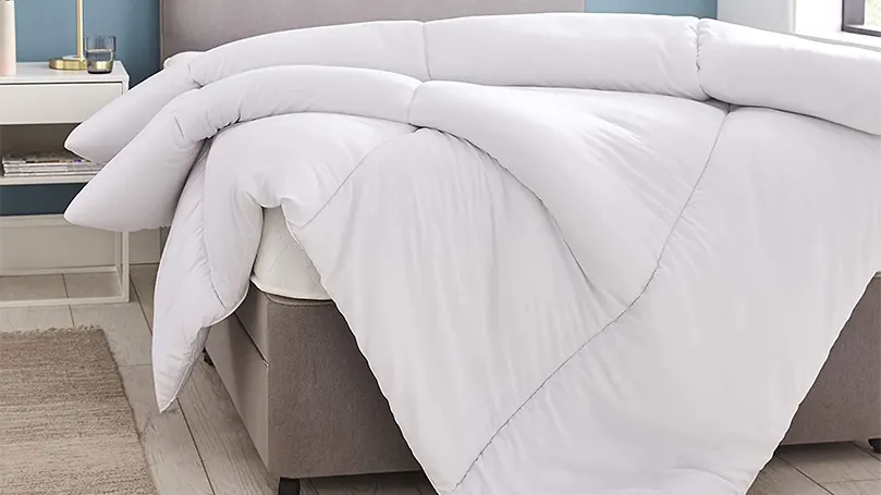An image of folded Silentnight Deep Sleep Duvet on bed.