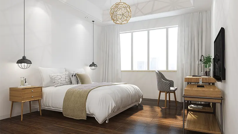 An image of a bedroom with pendant light.