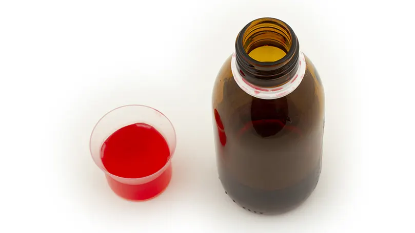 An image of a bottle of cough syrup.