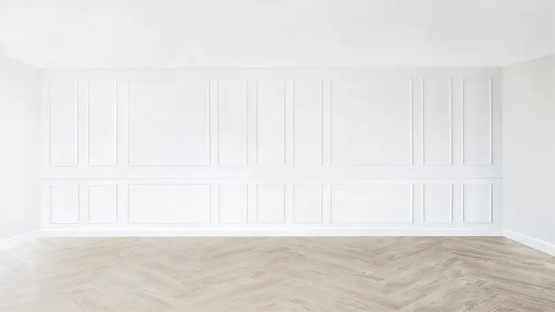 An image of a white wall with a geometrical pattern