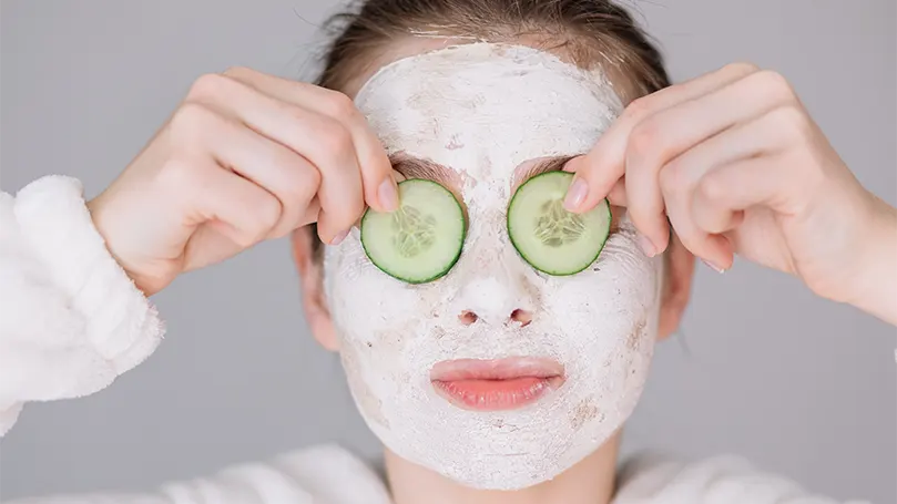 a-woman-with-cucumber-eye-mask