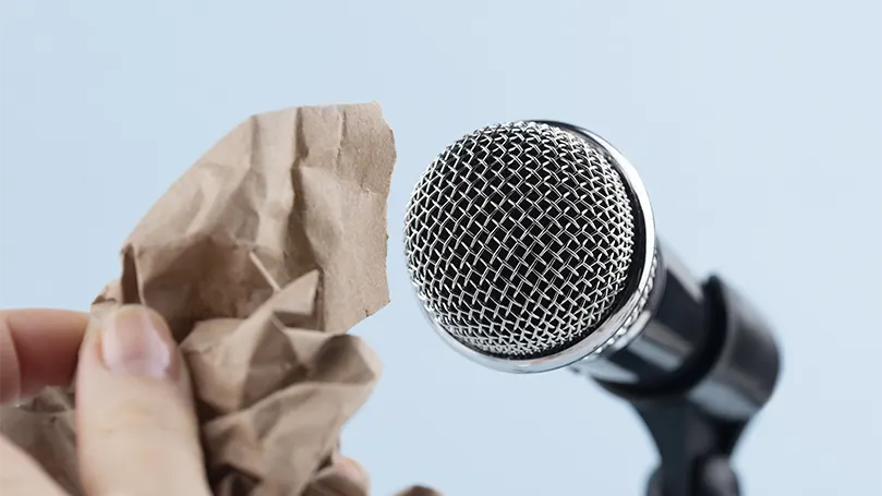 An image of asmr microphone and wrinkled paper.