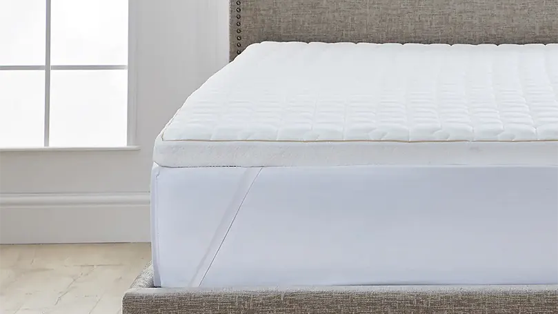 An image of Dorma Tencel Blend Memory Foam Mattress Topper on a bed in a bedroom.