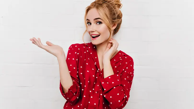 A young woman in a red pyjama