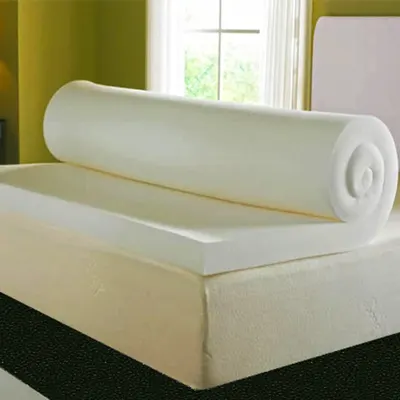 Product image of the Visco Therapy Mattress Topper rolled on bed