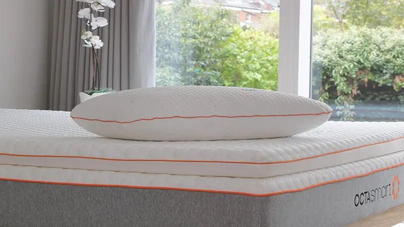 An image of Dormeo Octasmart pillow on a bed.