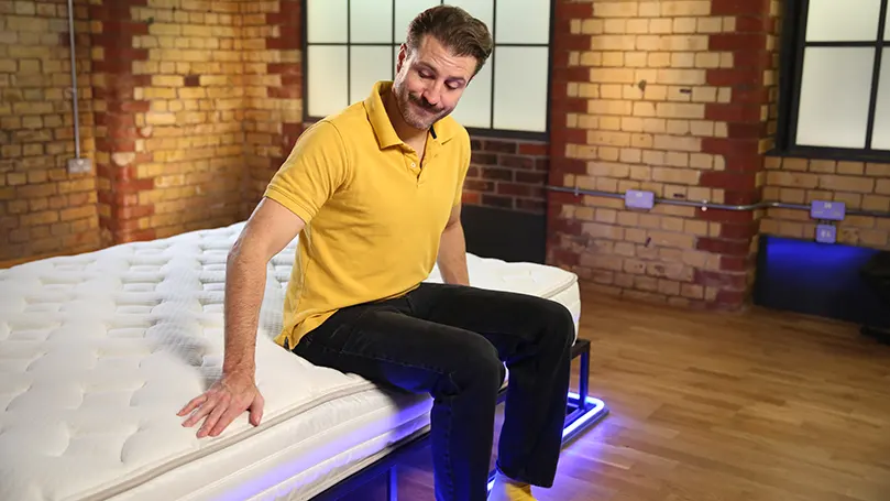 Our reviewer testing the features of Silentnight Miracoil Memory mattress