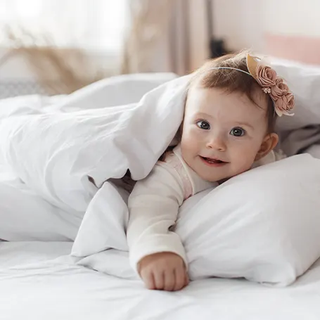 A baby on a pillow