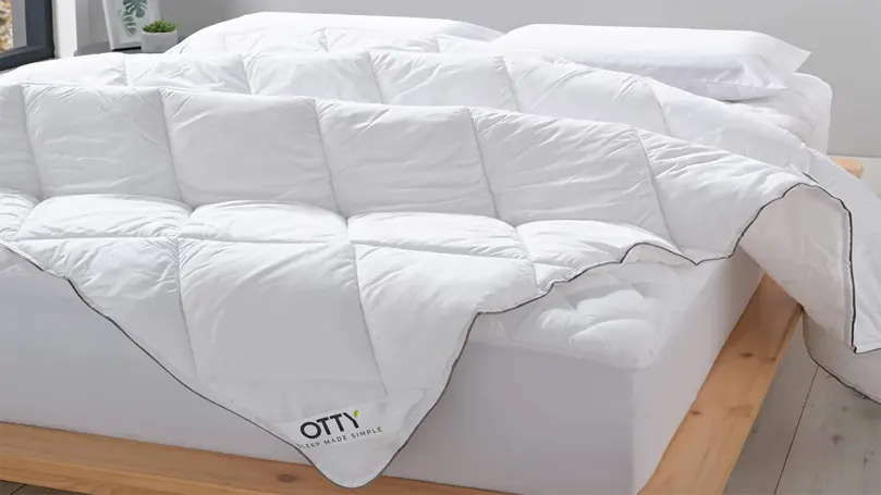 An image of otty deluxe microfibre duvet spread over the bed.