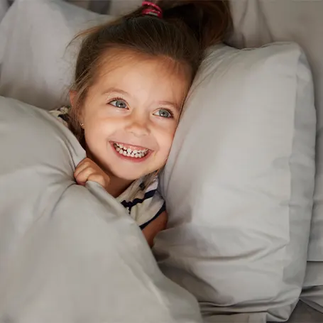 A little girl in bed going to sleep
