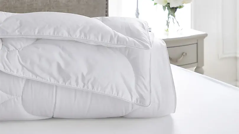 An image of Dorma Dream Deluxe 10.5 Tog Duvet on a bed.