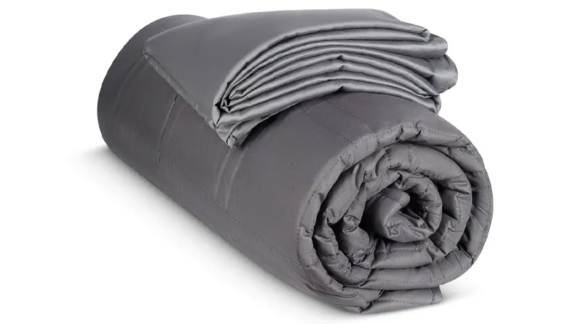 An image of rolled GnO Wellbeing Weighted Blanket.