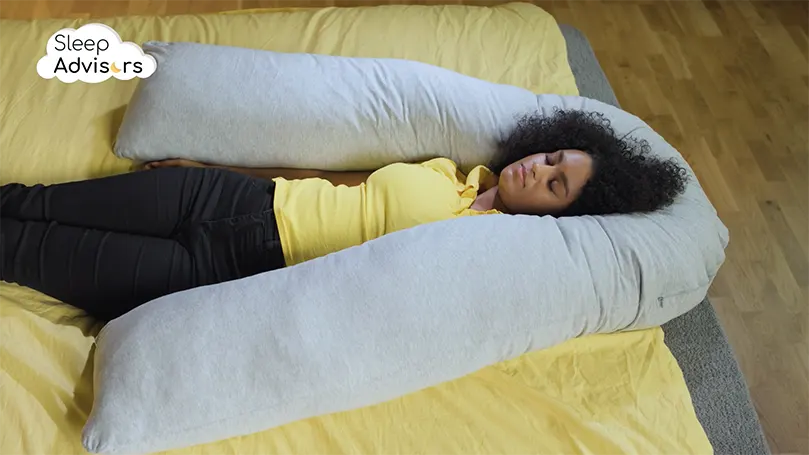 our reviewer sleeping with Kally U-Shaped Pregnancy Pillow around her