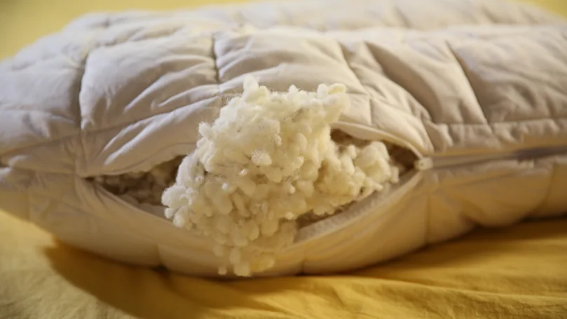 exposed wool filling from Woolroom V-Shaped Wool Pillow