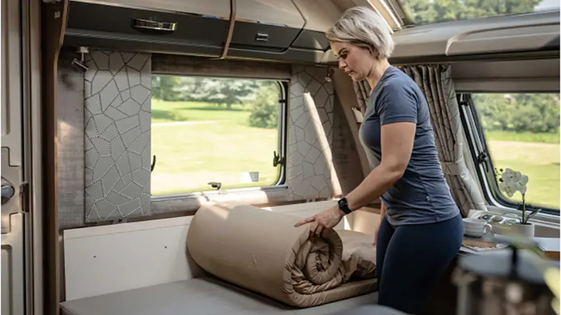 An image of a woman testing Duvalay Compact Sleeping Bag.