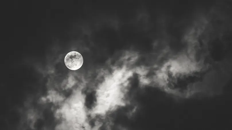 An image of the moon and the surrounding clouds
