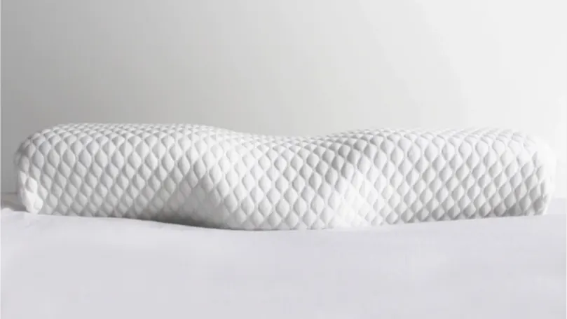 An image of The Original Groove pillow on bed.