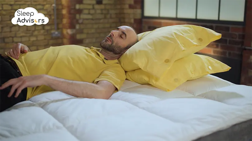 An image of a The Sleep Advisors reviewer laying on a Dorma Full Forever Mattress Topper