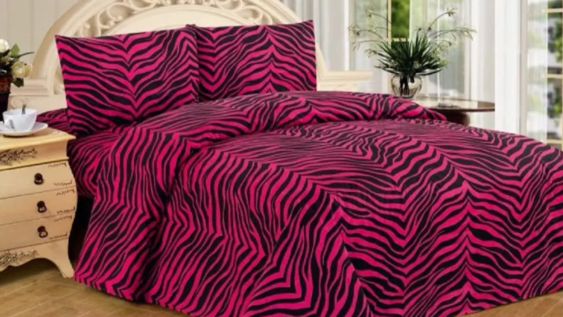 An image of pink zebra print beding.