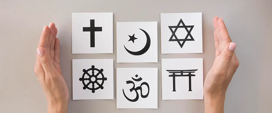 Hands open to different religions