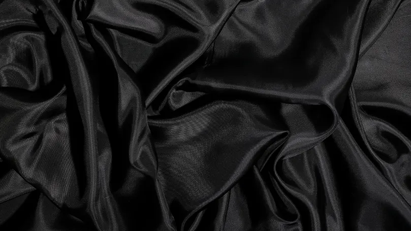a close up of black satin.