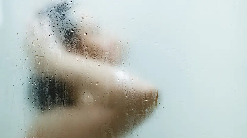 An image of a woman showering.