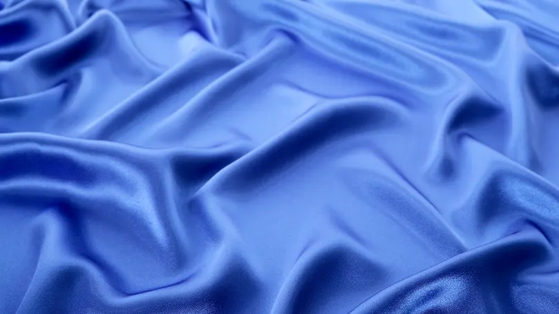 a close up of blue satin.